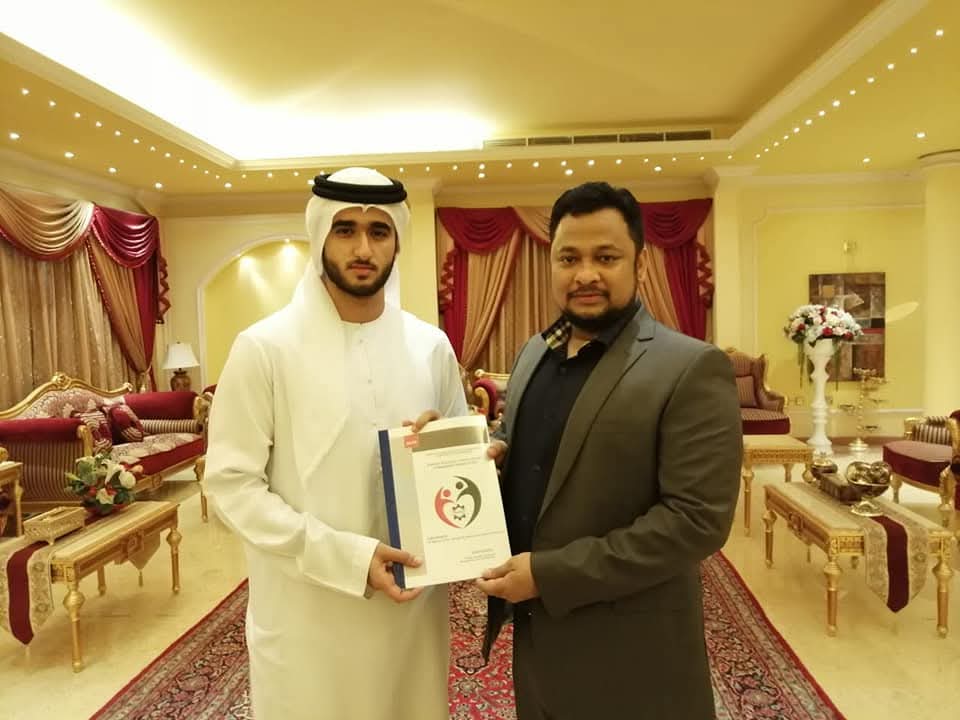 Dr. Kamrul while handing over the policy paper of Bangaldeshi expat's welfare in the UAE to the prince Abdullah bin Maktoum, the son of Ruler of Dubai